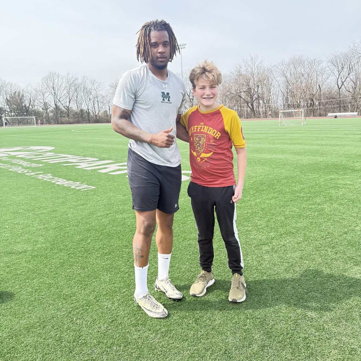 Coach Kanou working with a young player
