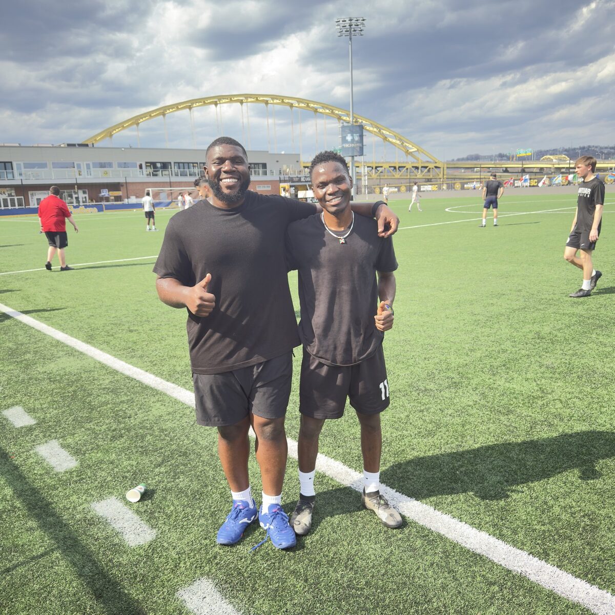 Candid moment with a teammate on the field